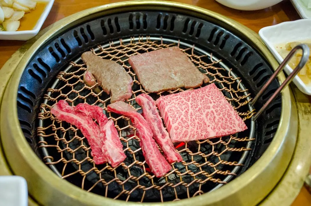 A crispy display of golden Korean street-food fritters and fried snacks